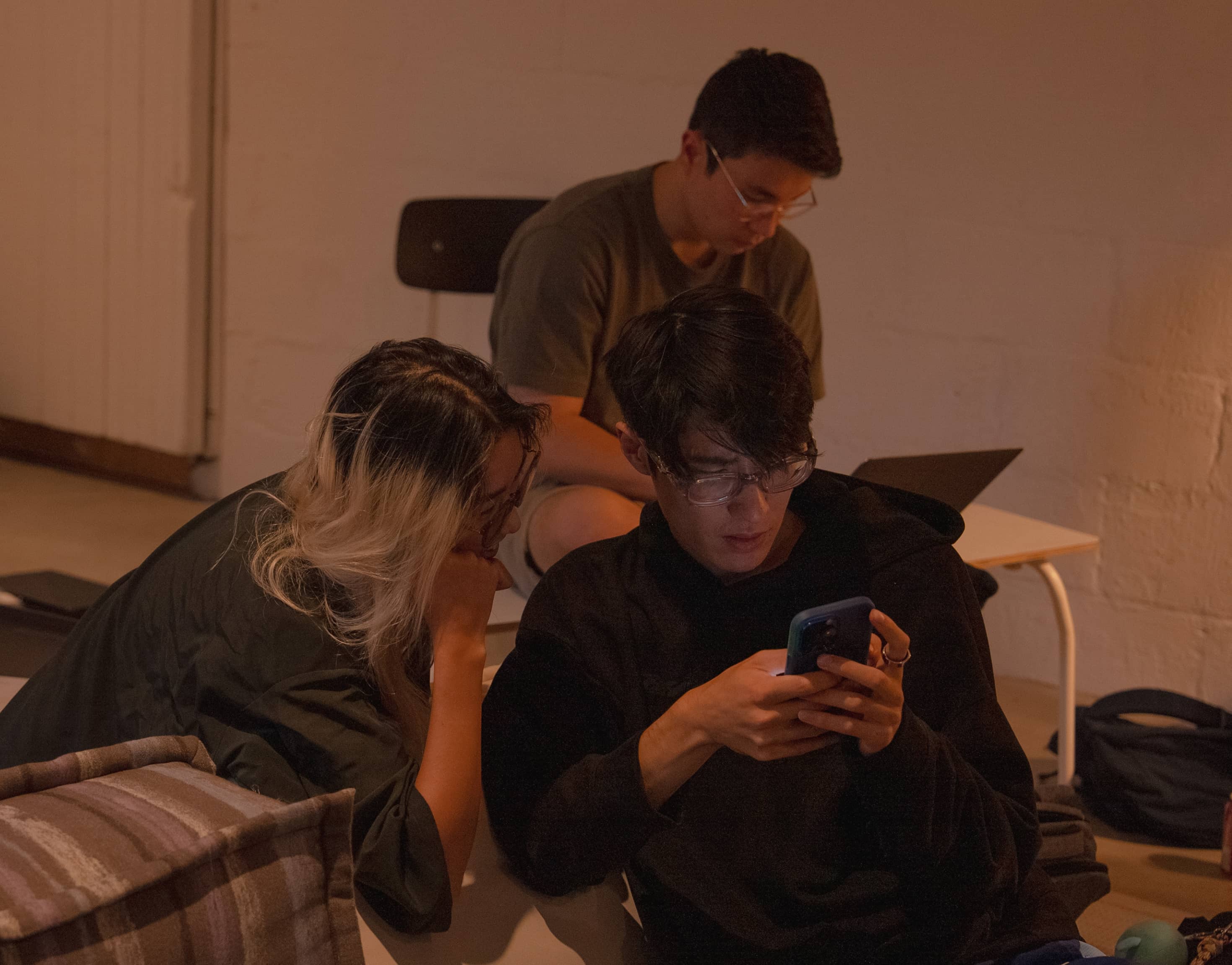 Teams building projects together at a Cursor hackathon.